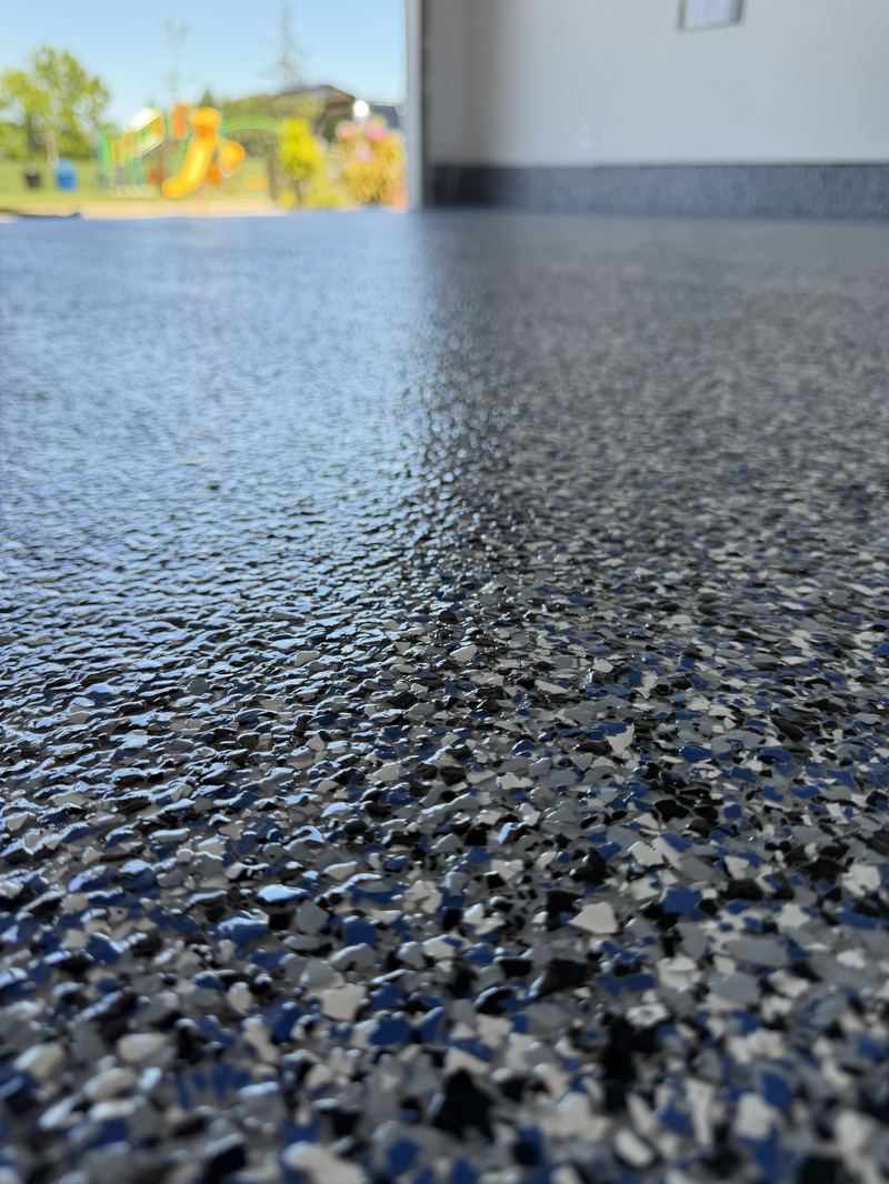 Blue and black flake epoxy floor close-up