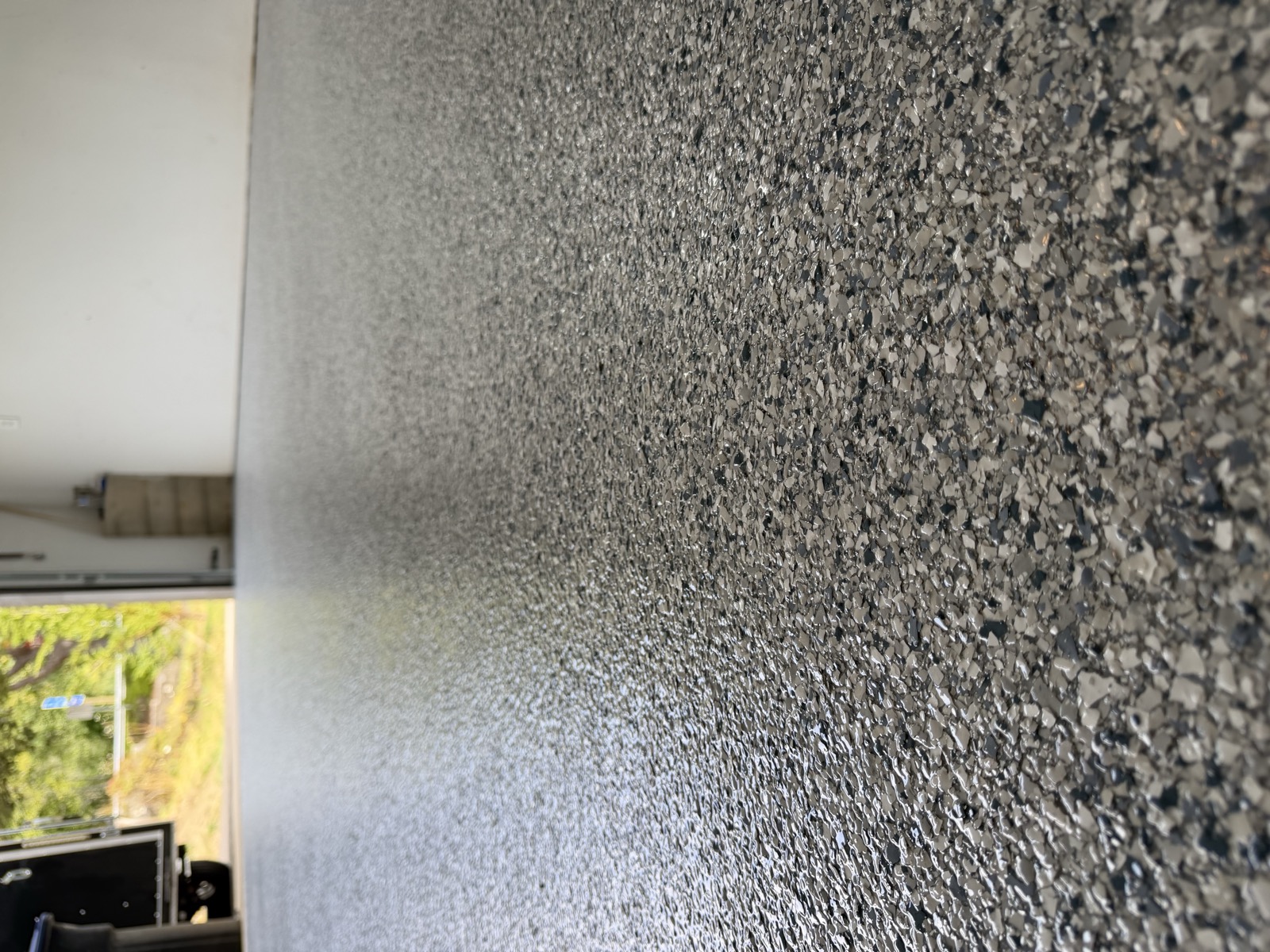Gray and black flake epoxy floor close-up
