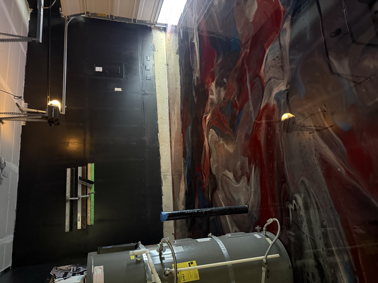 Red, white and blue metallic epoxy floor with water heater view