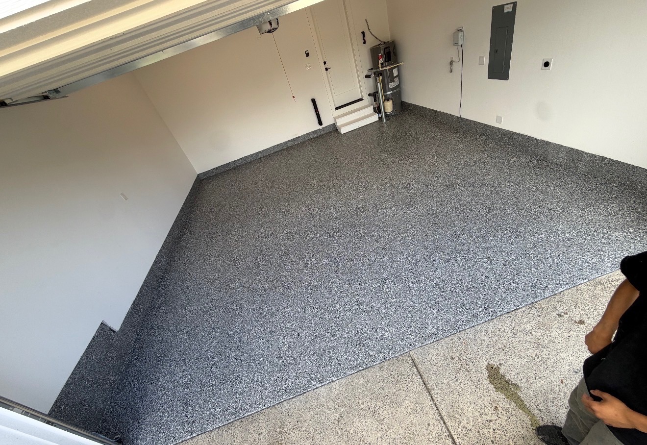 Wide view of gray flake epoxy garage floor installation